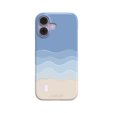 Beach phone case featuring layered blue waves graduating to a sandy beige shore with two miniature striped beach umbrellas, from the Memories of Summer collection, phone case by Caselier — snap case, front view