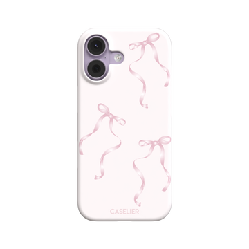 Bows phone case with scattered pink satin ribbon bows on a soft blush background, coquette style, phone case by Caselier — snap case, front view