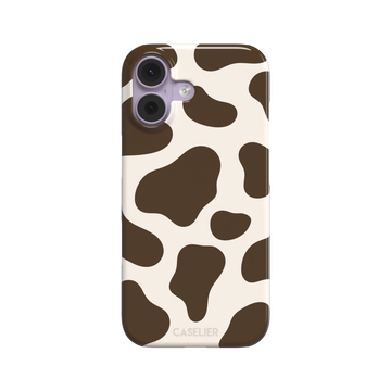 Cow print phone case in deep brown and cream with large irregular spots covering the full back, phone case by Caselier — snap case, front view