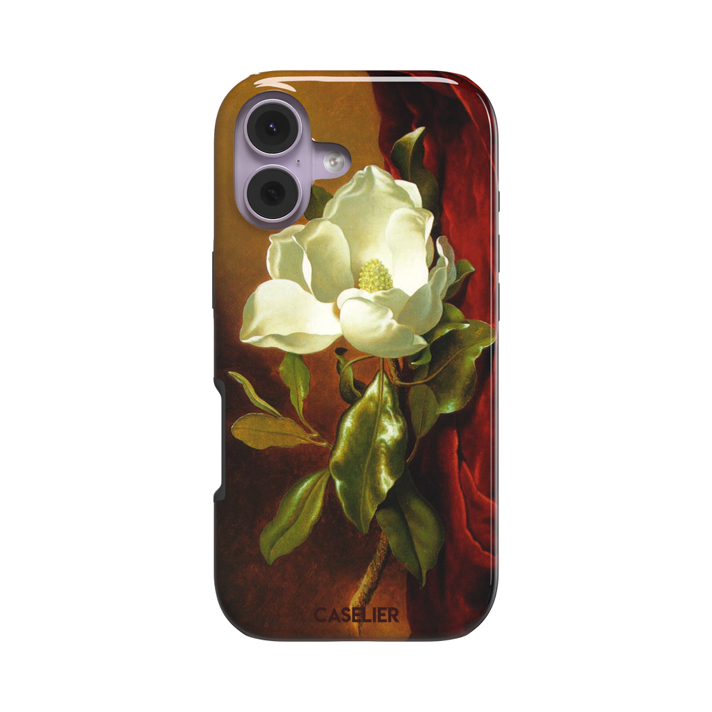 A Magnolia on Red Velvet by Martin Johnson Heade phone case showing a luminous white magnolia bloom with deep green leaves against rich red velvet drapery on a warm amber background, phone case by Caselier — tough case, front view
