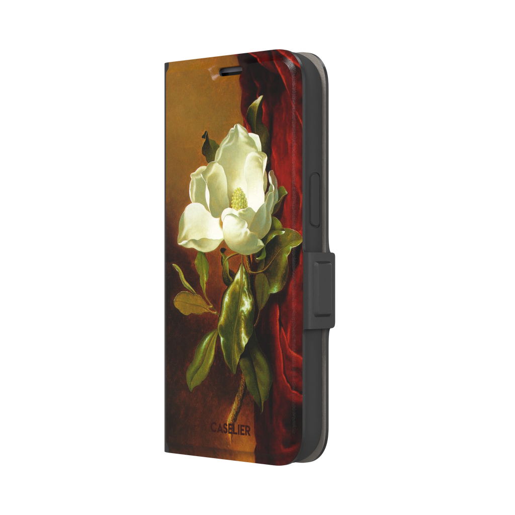 A Magnolia on Red Velvet by Martin Johnson Heade phone case showing a luminous white magnolia bloom with deep green leaves against rich red velvet drapery on a warm amber background, phone case by Caselier — wallet case, right view