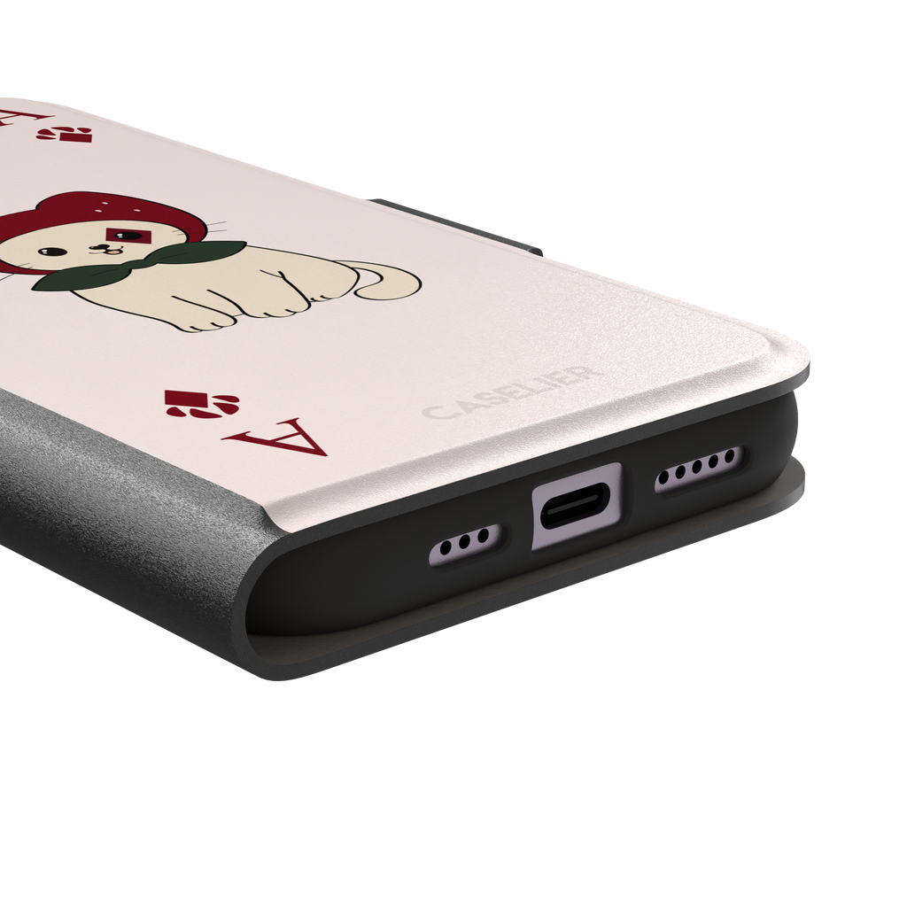 Ace of Diamonds phone case in blush pink with a kawaii cream cat wearing a crimson hood and green bow tie, Ace and paw-print diamond suit symbols at each corner, from the Paw Decks collection — wallet case, charging port detail