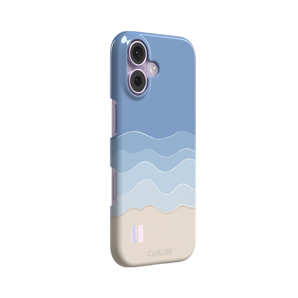 Beach phone case featuring layered blue waves graduating to a sandy beige shore with two miniature striped beach umbrellas, from the Memories of Summer collection, phone case by Caselier — snap case, left view