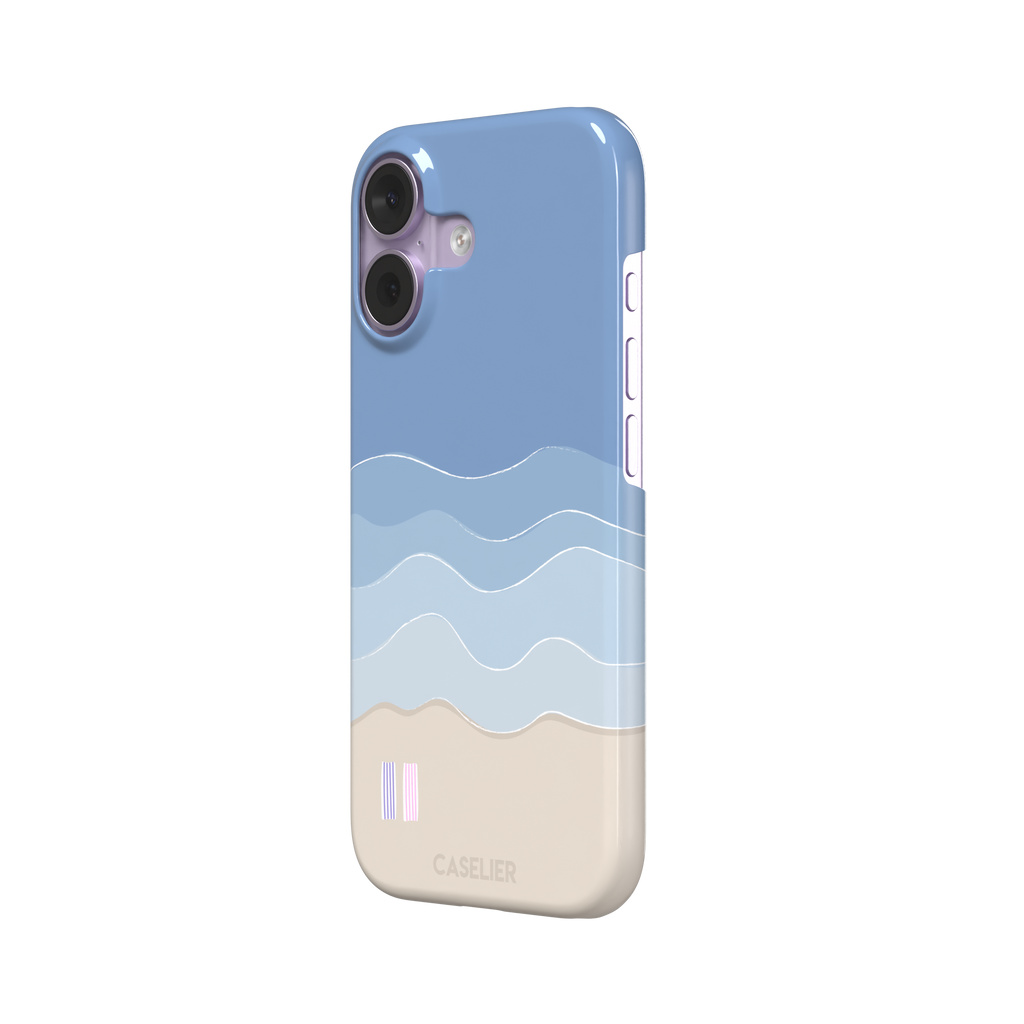 Beach phone case featuring layered blue waves graduating to a sandy beige shore with two miniature striped beach umbrellas, from the Memories of Summer collection, phone case by Caselier — snap case, right view