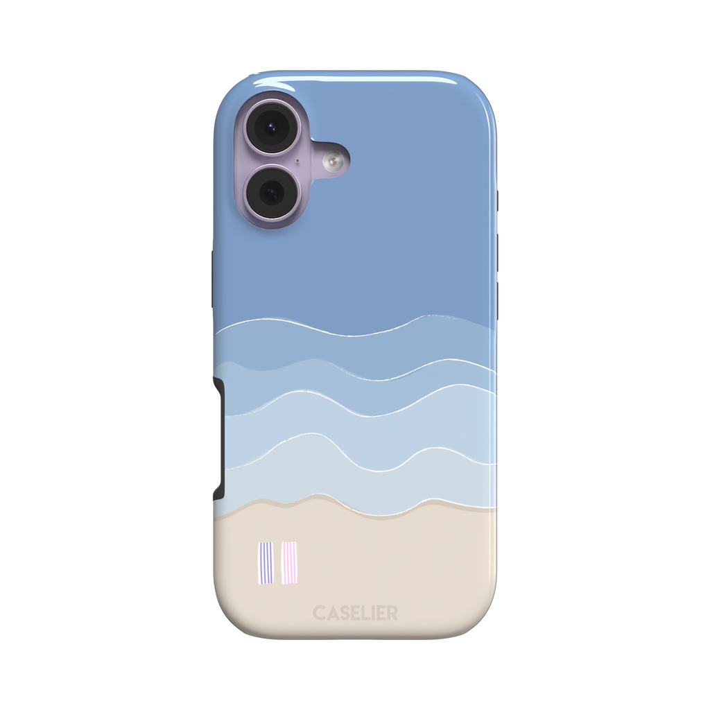 Beach phone case featuring layered blue waves graduating to a sandy beige shore with two miniature striped beach umbrellas, from the Memories of Summer collection, phone case by Caselier — tough case, front view