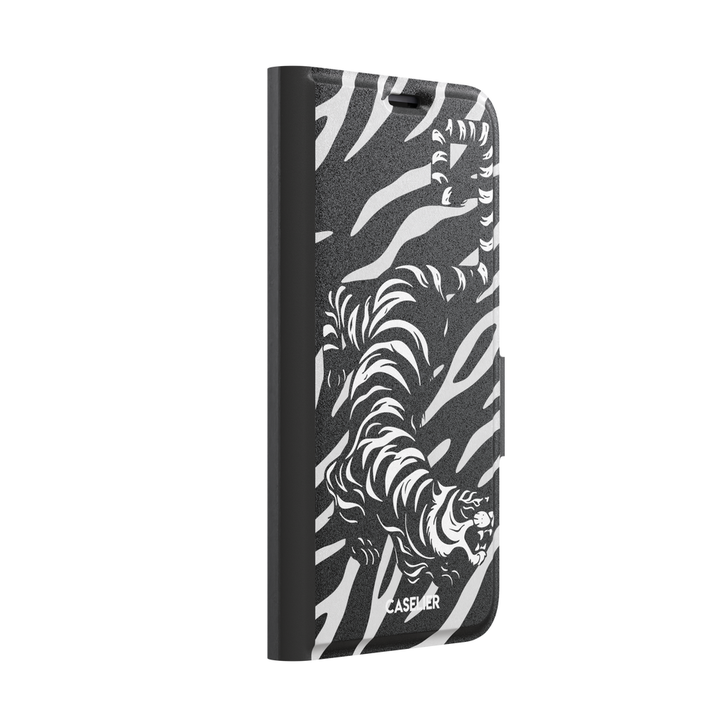 Big Kitty phone case in black — white graphic tiger prowling across a black background with bold stripe patterns, phone case by Caselier — wallet case, left view