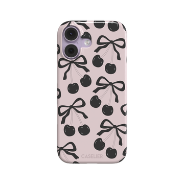 Black Cherry phone case with an all-over pattern of black cherries and ribbon bows on a blush pink background, phone case by Caselier — snap case, front view
