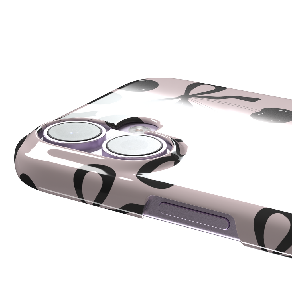 Black Cherry phone case with an all-over pattern of black cherries and ribbon bows on a blush pink background, phone case by Caselier — snap case, volume buttons detail