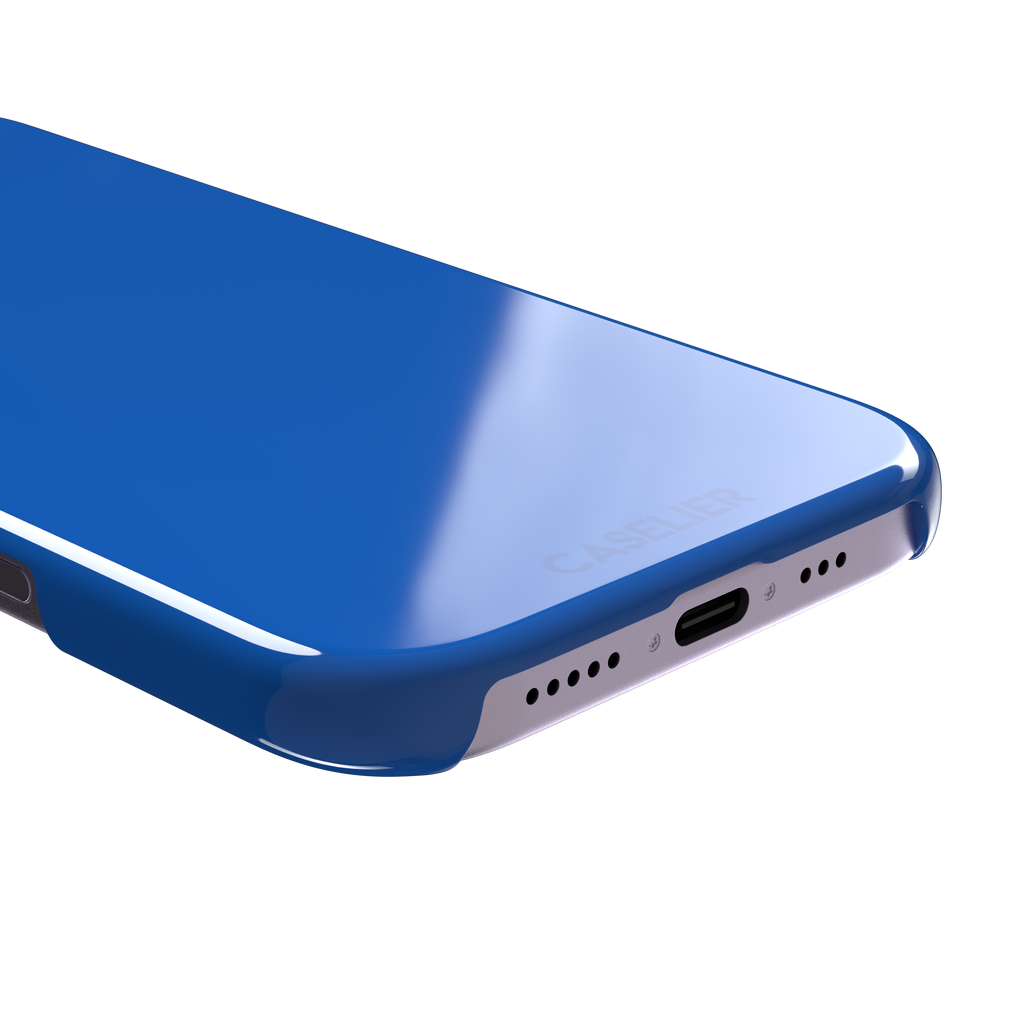 Vivid cobalt blue solid-color phone case with smooth matte finish, front view, phone case by Caselier — snap case, charging port detail