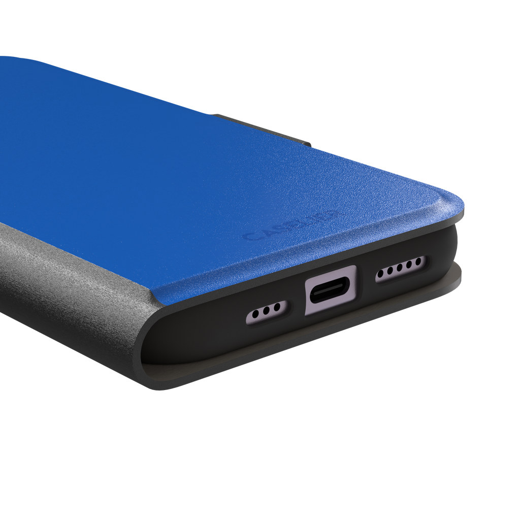 Vivid cobalt blue solid-color phone case with smooth matte finish, front view, phone case by Caselier — wallet case, charging port detail