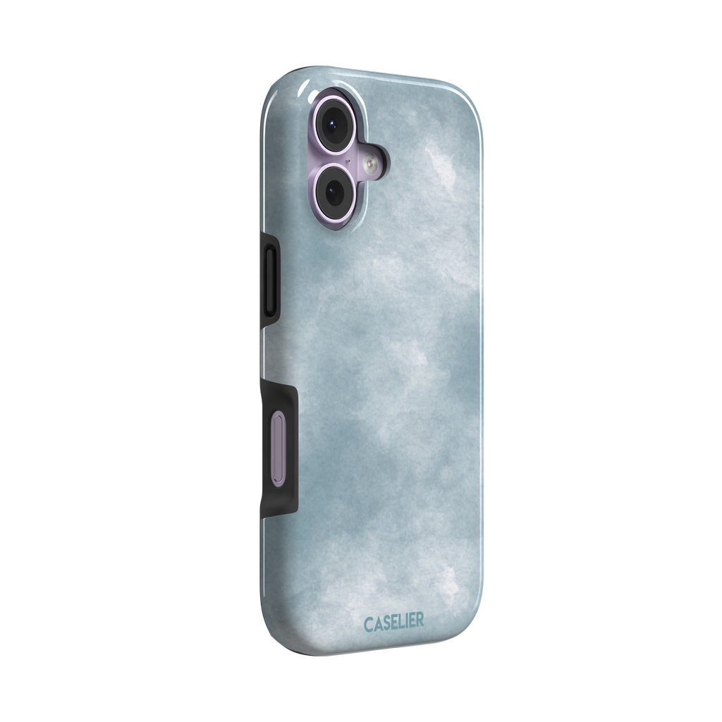 Soft powder-blue watercolor wash phone case with misty white cloud-like blends, phone case by Caselier — tough case, left view