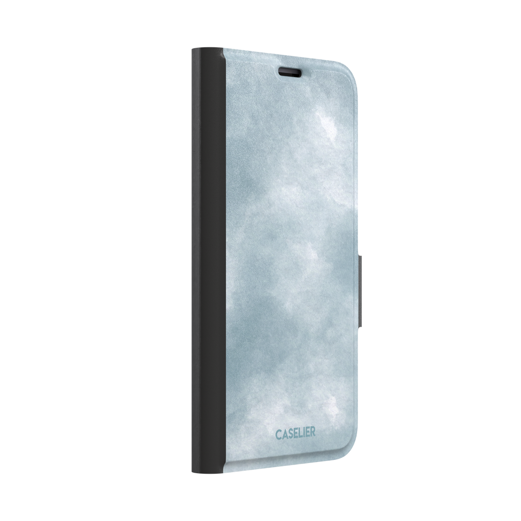 Soft powder-blue watercolor wash phone case with misty white cloud-like blends, phone case by Caselier — wallet case, left view