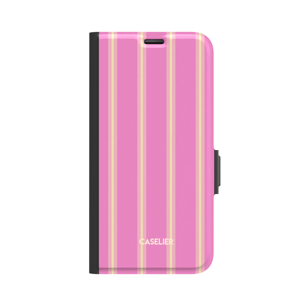 Bold Classy Stripes folio wallet case in hot pink with soft yellow vertical stripe pairs, black border and side clasp, front-facing flat lay on white background, phone case by Caselier - wallet case, front view | Caselier