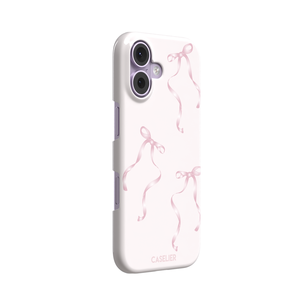 Bows phone case with scattered pink satin ribbon bows on a soft blush background, coquette style, phone case by Caselier — snap case, left view