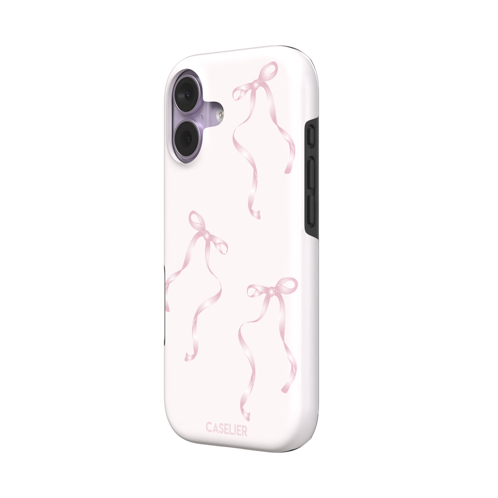 Bows phone case with scattered pink satin ribbon bows on a soft blush background, coquette style, phone case by Caselier — tough case, right view