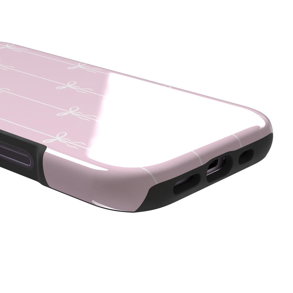 Bows on String phone case in pale pink with white bow and stripe repeat pattern, phone case by Caselier — tough case, charging port detail