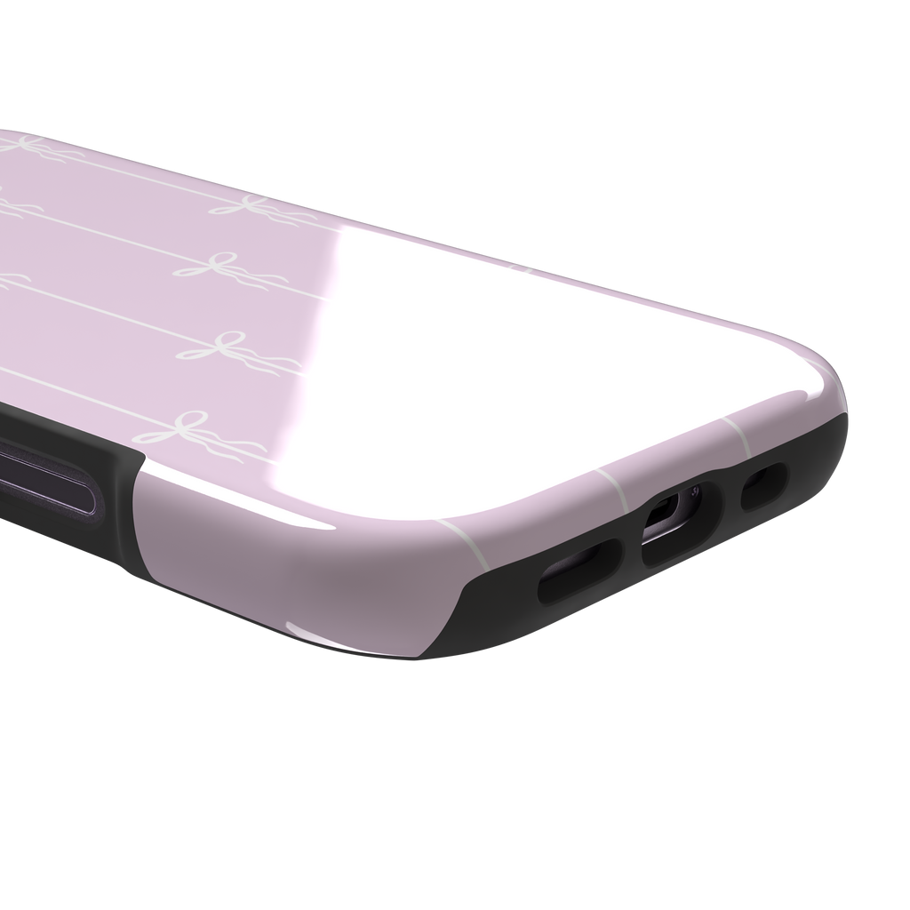 Bows on String phone case in soft lilac pink with white ribbon bows on vertical stripes, phone case by Caselier — tough case, charging port detail