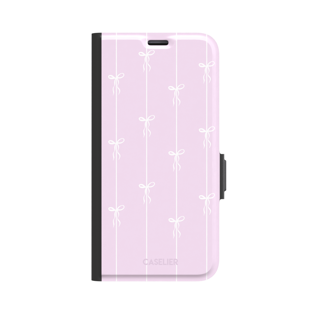 Bows on String phone case in soft lilac pink with white ribbon bows on vertical stripes, phone case by Caselier — wallet case, front view