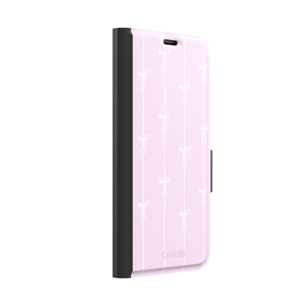 Bows on String phone case in soft lilac pink with white ribbon bows on vertical stripes, phone case by Caselier — wallet case, left view