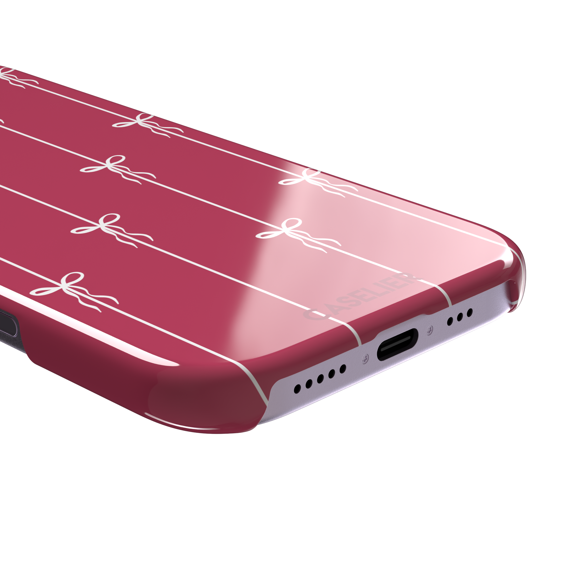 Bows on String phone case in raspberry pink with white ribbon bows tied along vertical stripes, phone case by Caselier — snap case, charging port detail
