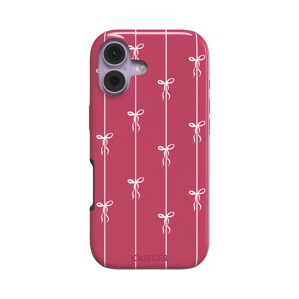 Bows on String phone case in raspberry pink with white ribbon bows tied along vertical stripes, phone case by Caselier — tough case, front view