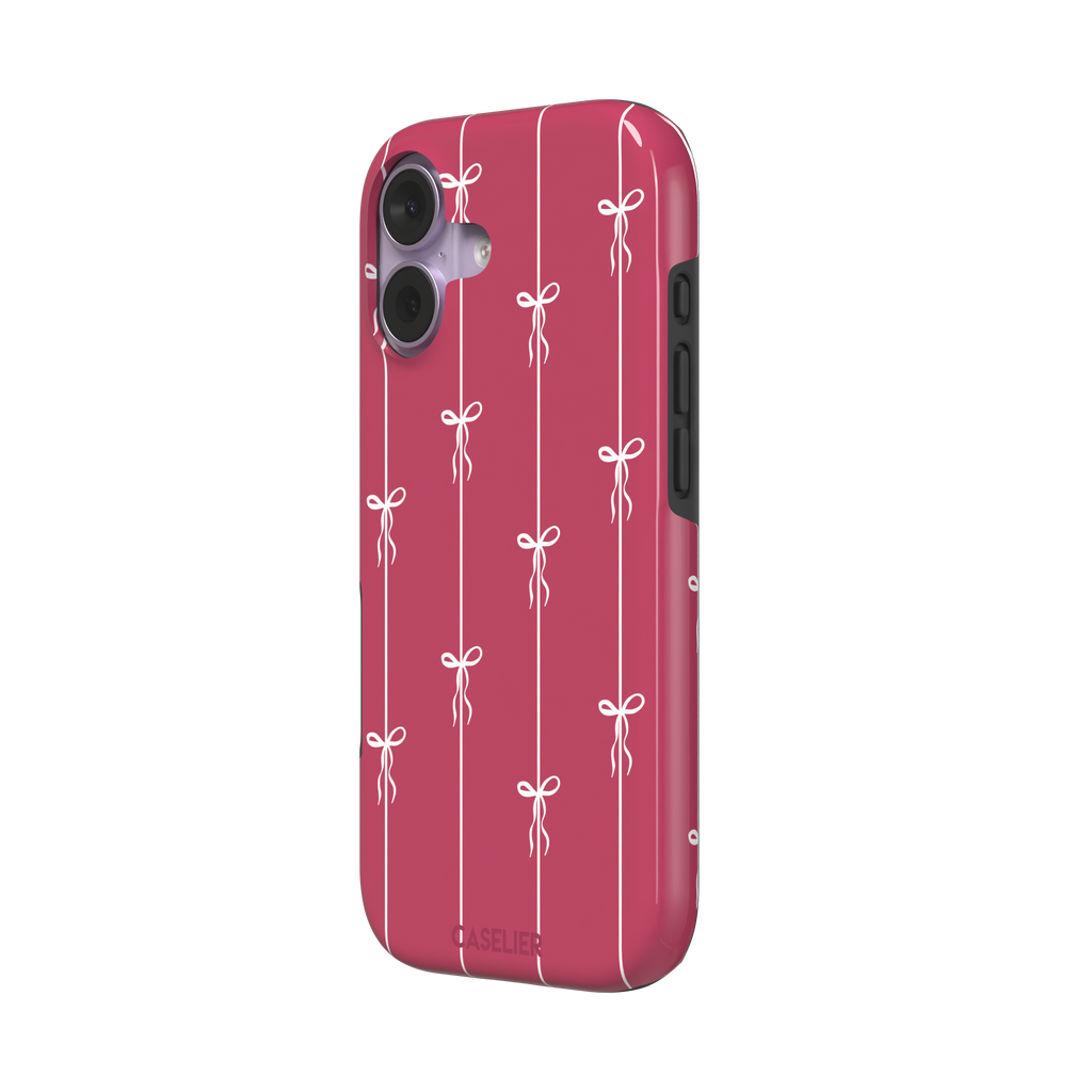 Bows on String phone case in raspberry pink with white ribbon bows tied along vertical stripes, phone case by Caselier — tough case, right view