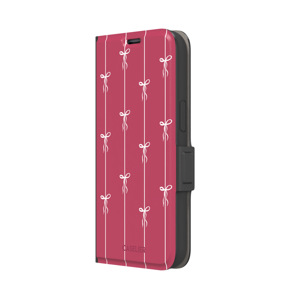 Bows on String phone case in raspberry pink with white ribbon bows tied along vertical stripes, phone case by Caselier — wallet case, right view