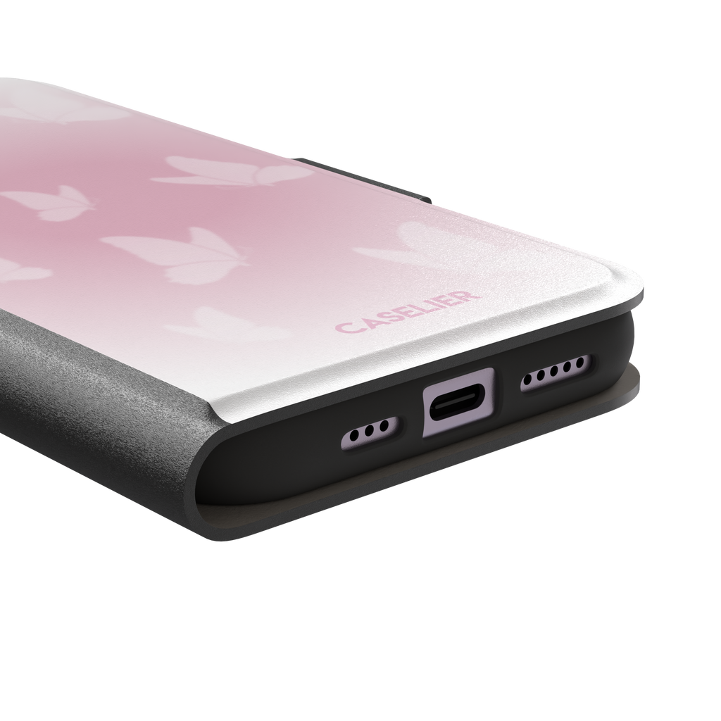 Butterflies phone case with soft pink gradient and scattered white butterfly silhouettes in a coquette style, phone case by Caselier — wallet case, charging port detail