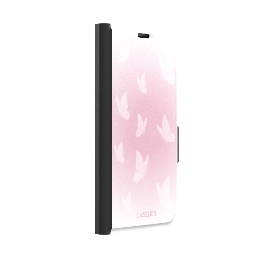 Butterflies phone case with soft pink gradient and scattered white butterfly silhouettes in a coquette style, phone case by Caselier — wallet case, left view