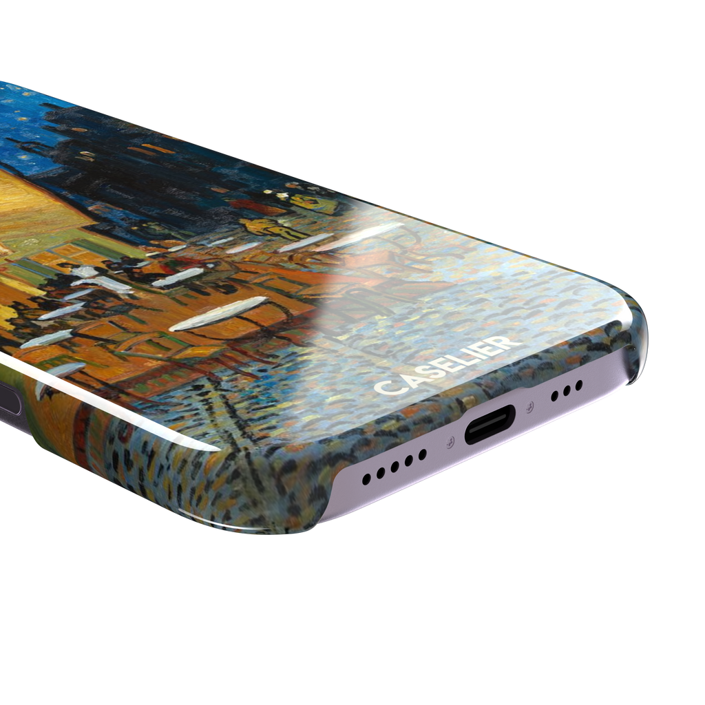Cafe Terrace at Night by Vincent van Gogh phone case showing a glowing golden café awning, cobblestone street, seated figures, and a deep blue starry night sky, phone case by Caselier — snap case, charging port detail