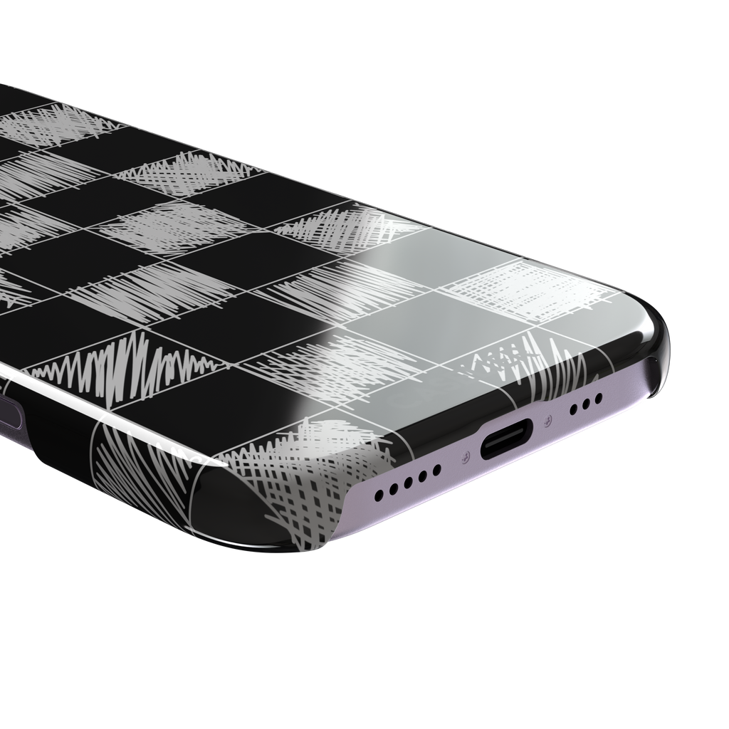 Black phone case with a checkerboard pattern where alternating squares are filled with rough white chalk-scrawl hatching lines, phone case by Caselier — snap case, charging port detail
