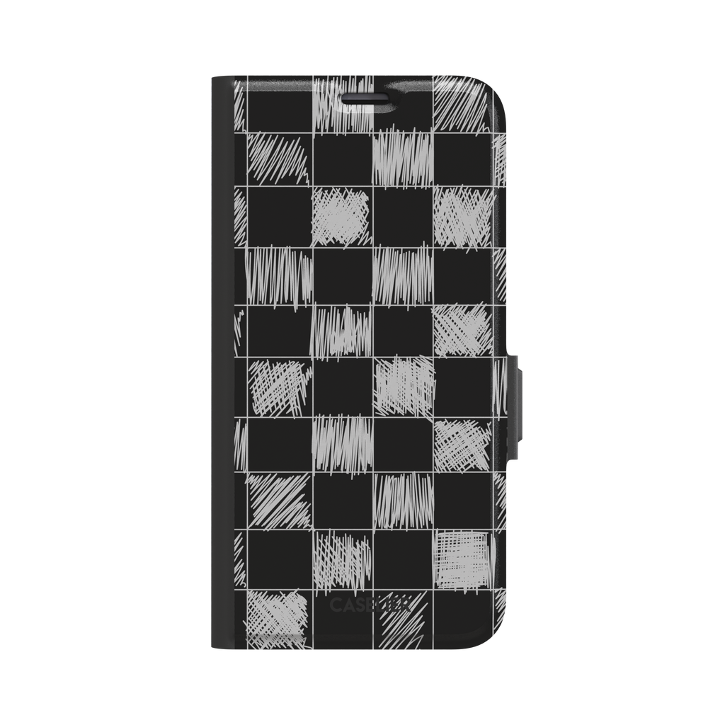 Black phone case with a checkerboard pattern where alternating squares are filled with rough white chalk-scrawl hatching lines, phone case by Caselier — wallet case, front view