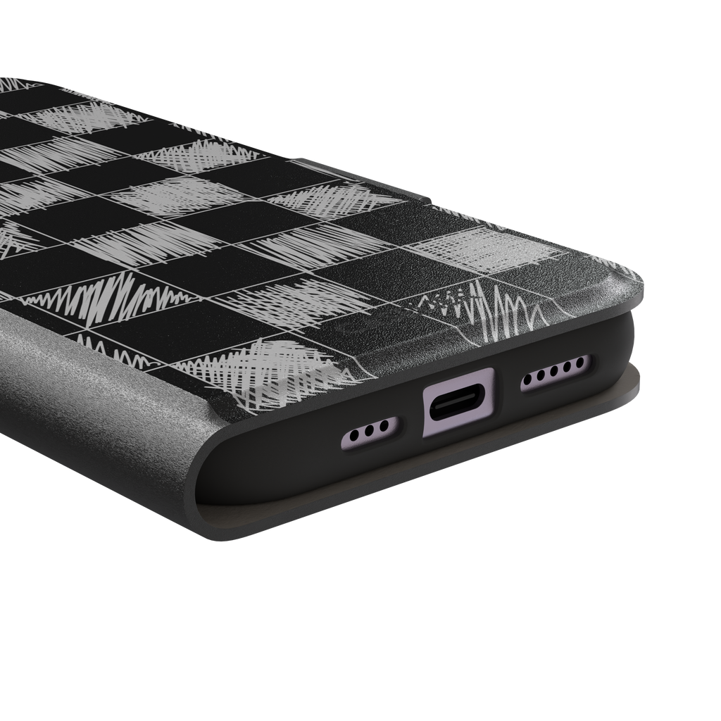 Black phone case with a checkerboard pattern where alternating squares are filled with rough white chalk-scrawl hatching lines, phone case by Caselier — wallet case, charging port detail