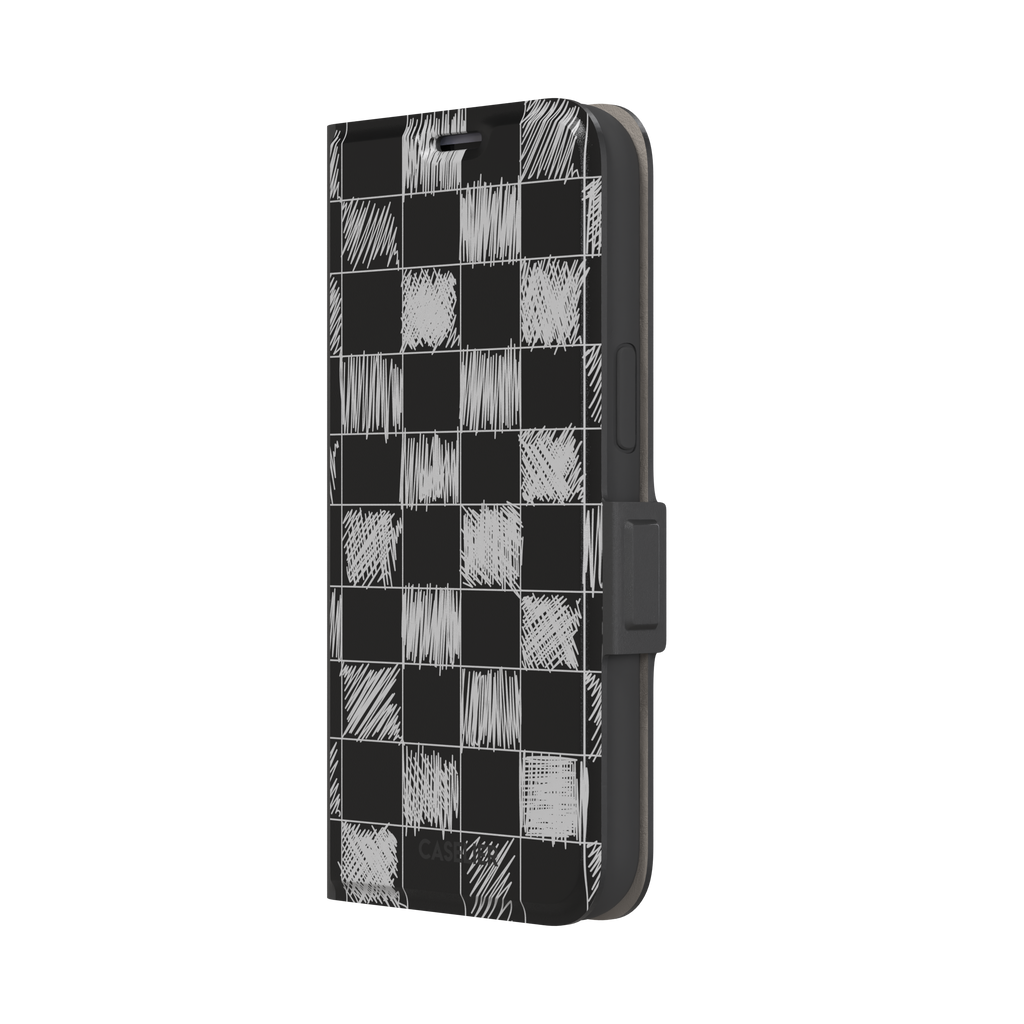 Black phone case with a checkerboard pattern where alternating squares are filled with rough white chalk-scrawl hatching lines, phone case by Caselier — wallet case, right view