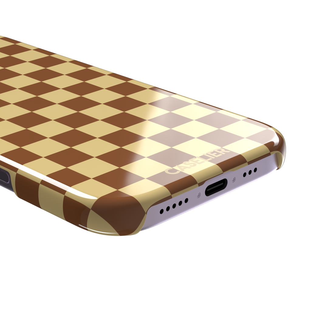 Checkered phone case in warm brown and pale yellow checkerboard pattern, phone case by Caselier — snap case, charging port detail