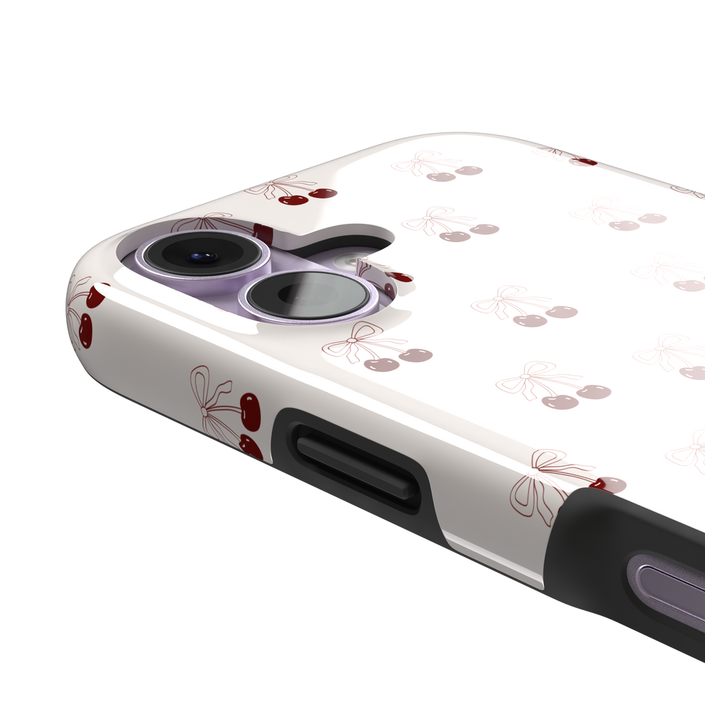 Cherry Bow phone case with glossy red cherries and delicate line-drawn bows scattered across a cream background, coquette style, phone case by Caselier — tough case, volume buttons detail