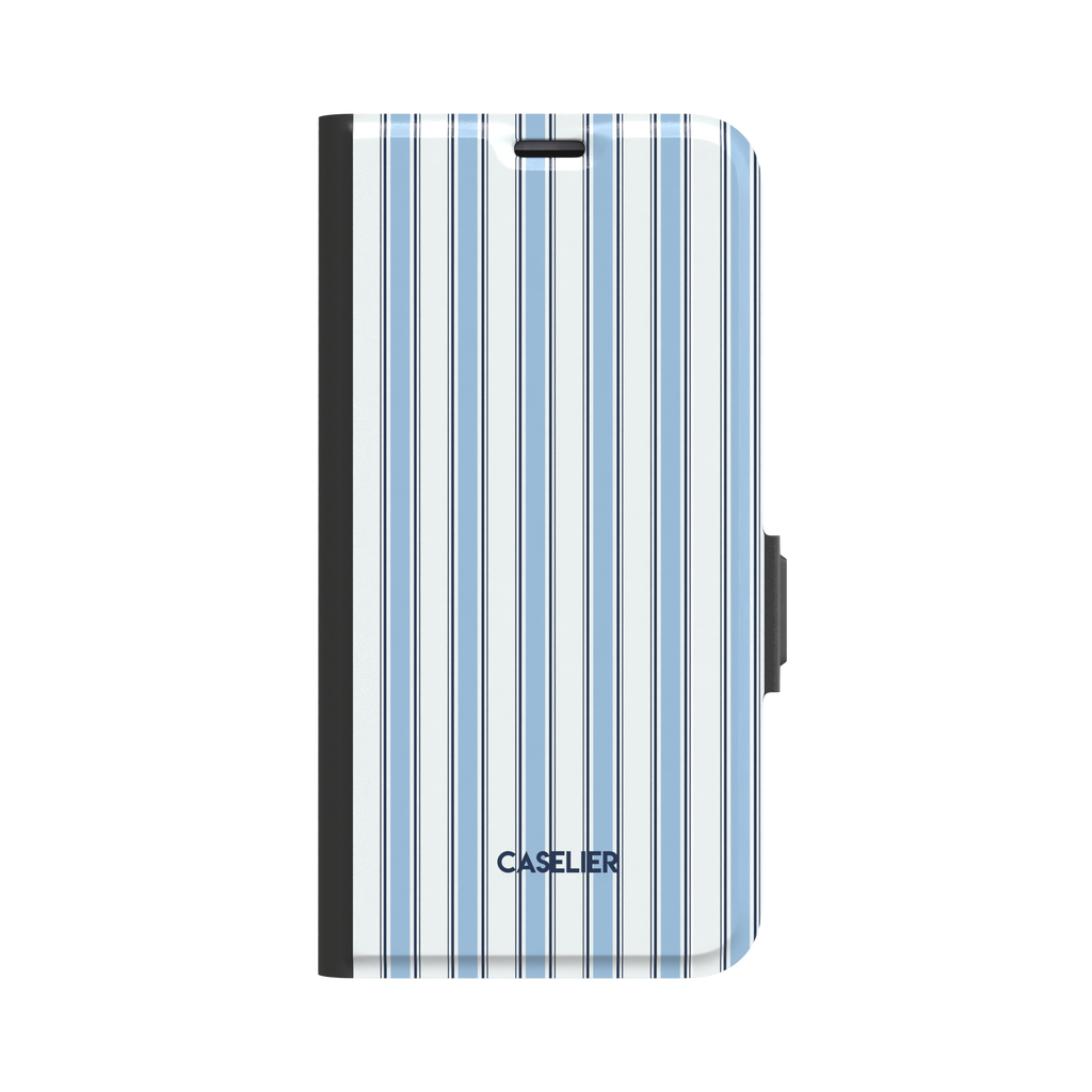 Classy Stripes folio wallet case in sky blue and white vertical ticking stripes with navy accent lines, black spine and magnetic clasp, front view on white background, phone case by Caselier - wallet case, front view | Caselier