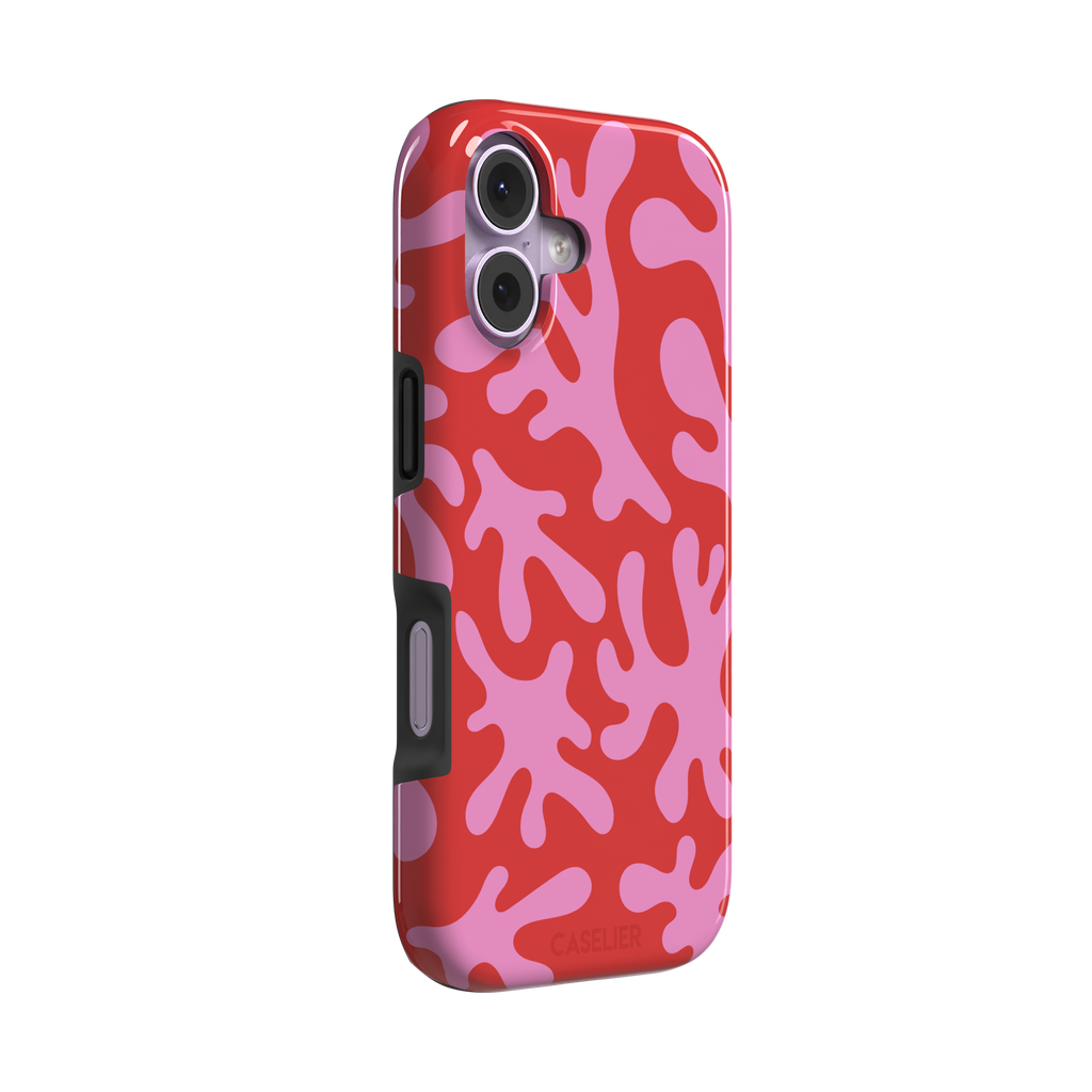 Coral Reef phone case in red and bubblegum pink with an all-over branching coral abstract pattern, phone case by Caselier — tough case, left view