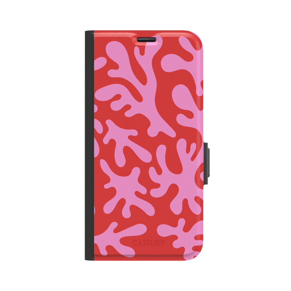 Coral Reef phone case in red and bubblegum pink with an all-over branching coral abstract pattern, phone case by Caselier — wallet case, front view