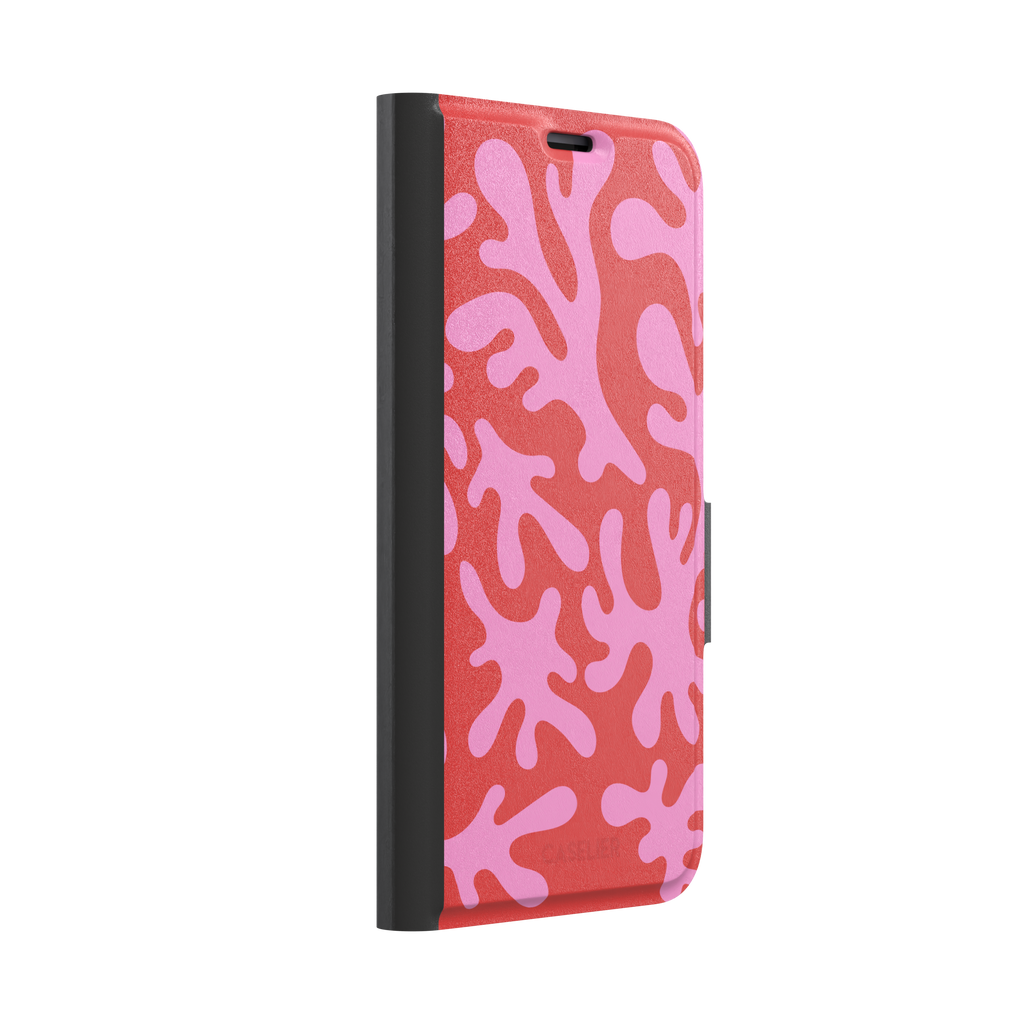 Coral Reef phone case in red and bubblegum pink with an all-over branching coral abstract pattern, phone case by Caselier — wallet case, left view