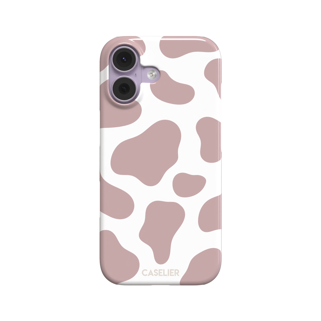 Cow print phone case in dusty rose pink and white with large soft-edged spots across the full back, phone case by Caselier — snap case, front view