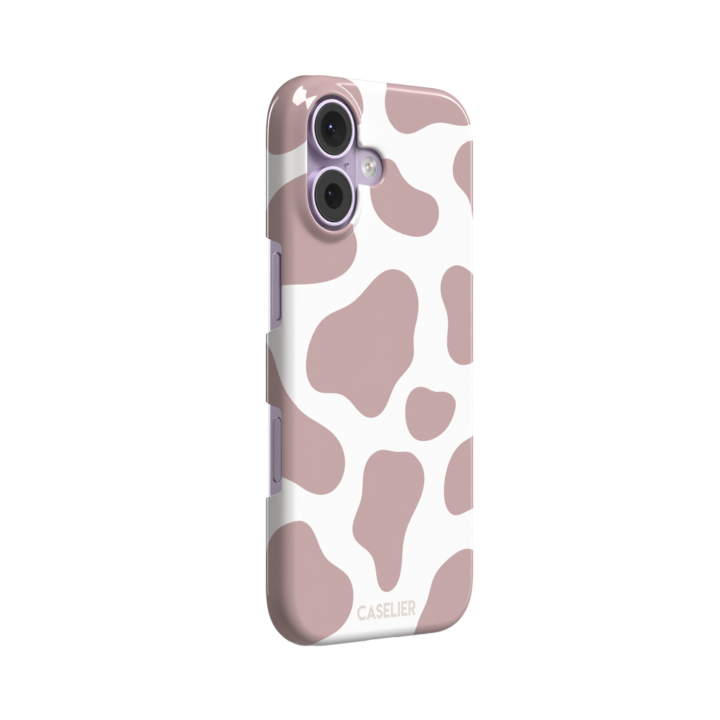 Cow print phone case in dusty rose pink and white with large soft-edged spots across the full back, phone case by Caselier — snap case, left view