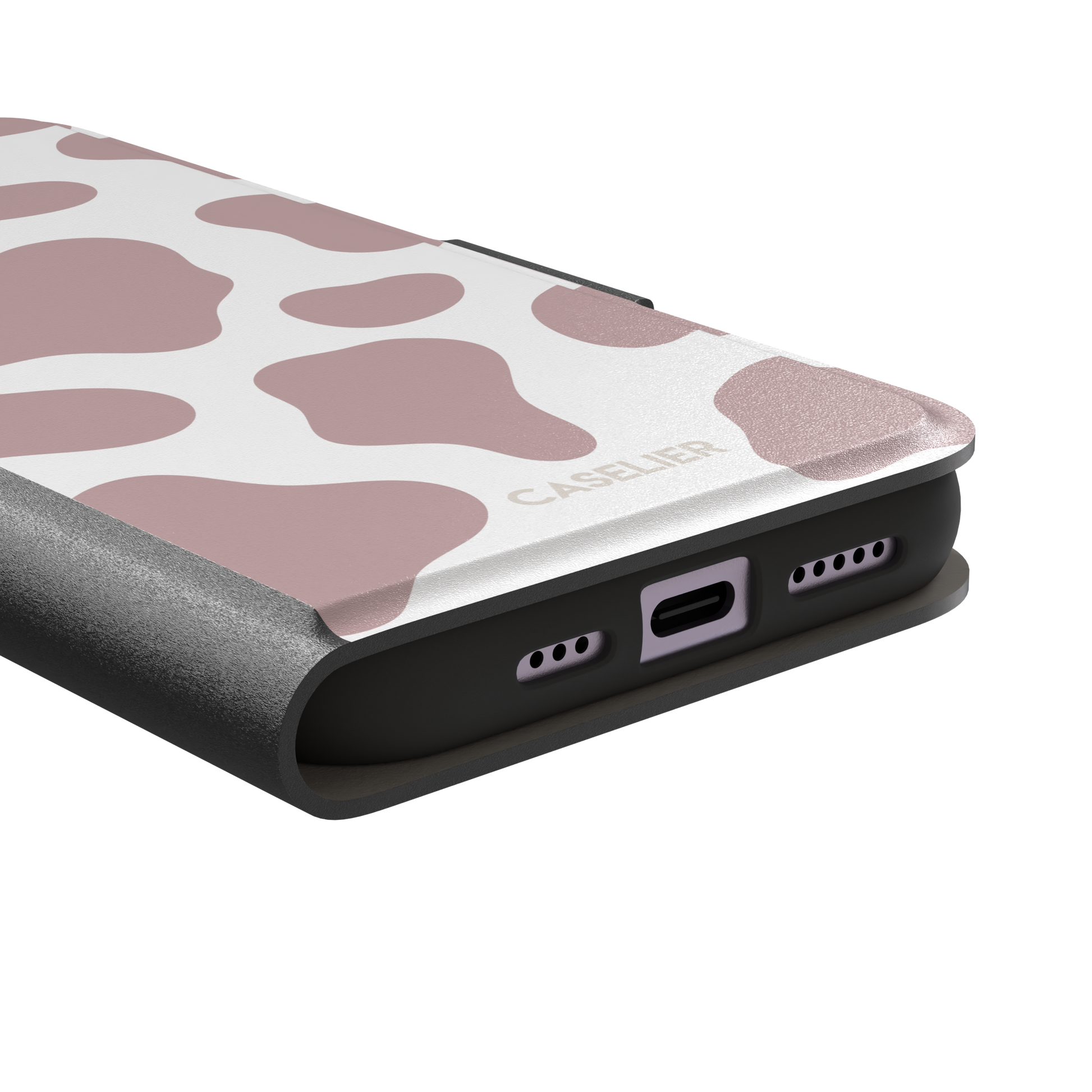 Cow print phone case in dusty rose pink and white with large soft-edged spots across the full back, phone case by Caselier — wallet case, charging port detail