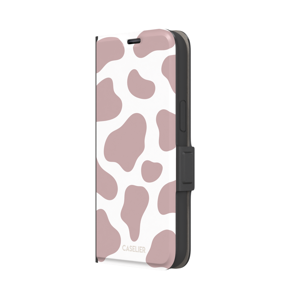 Cow print phone case in dusty rose pink and white with large soft-edged spots across the full back, phone case by Caselier — wallet case, right view