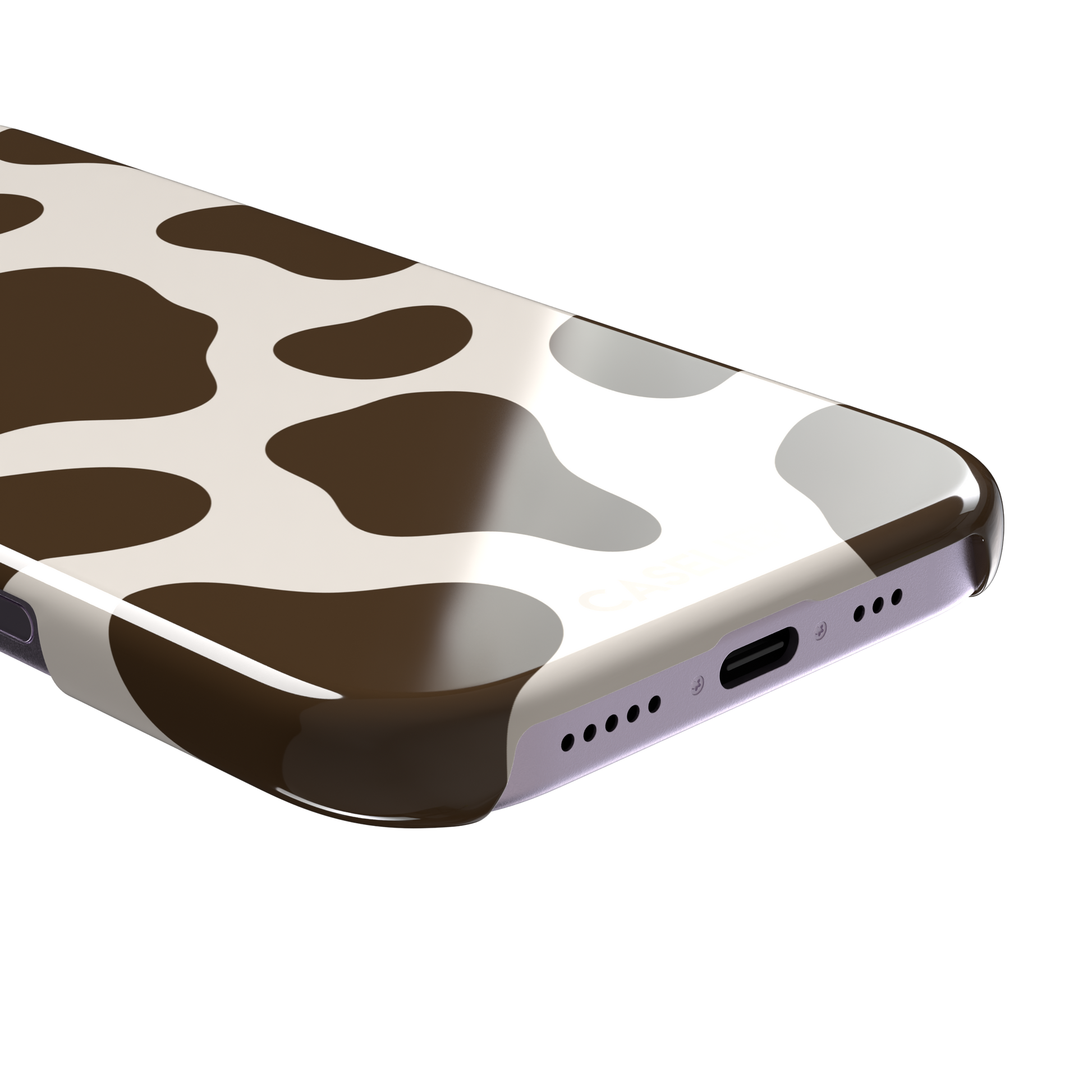 Cow print phone case in deep brown and cream with large irregular spots covering the full back, phone case by Caselier — snap case, charging port detail