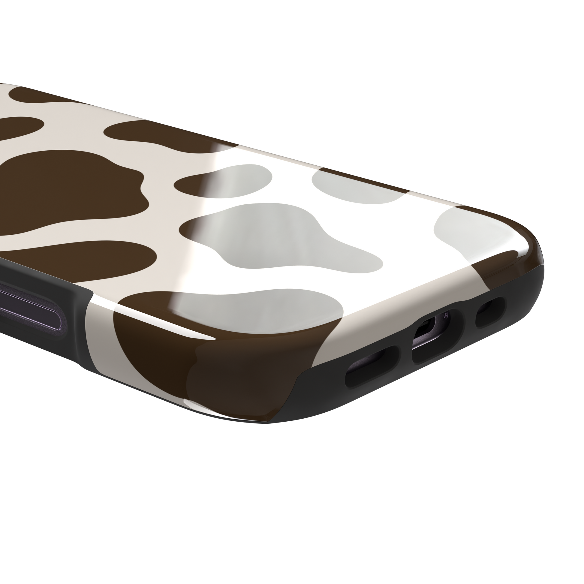 Cow print phone case in deep brown and cream with large irregular spots covering the full back, phone case by Caselier — tough case, charging port detail