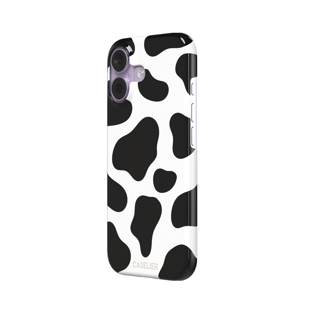 Cow print phone case in black and white with bold oversized spots on a clean white background, phone case by Caselier — snap case, right view