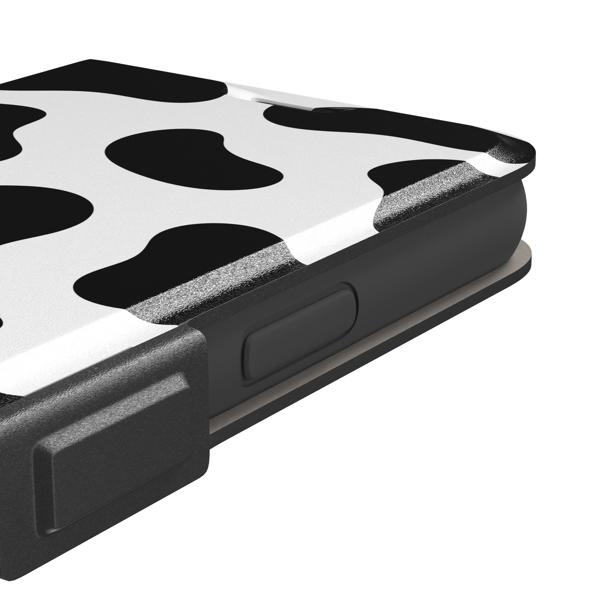 Cow print phone case in black and white with bold oversized spots on a clean white background, phone case by Caselier — wallet case, volume buttons detail