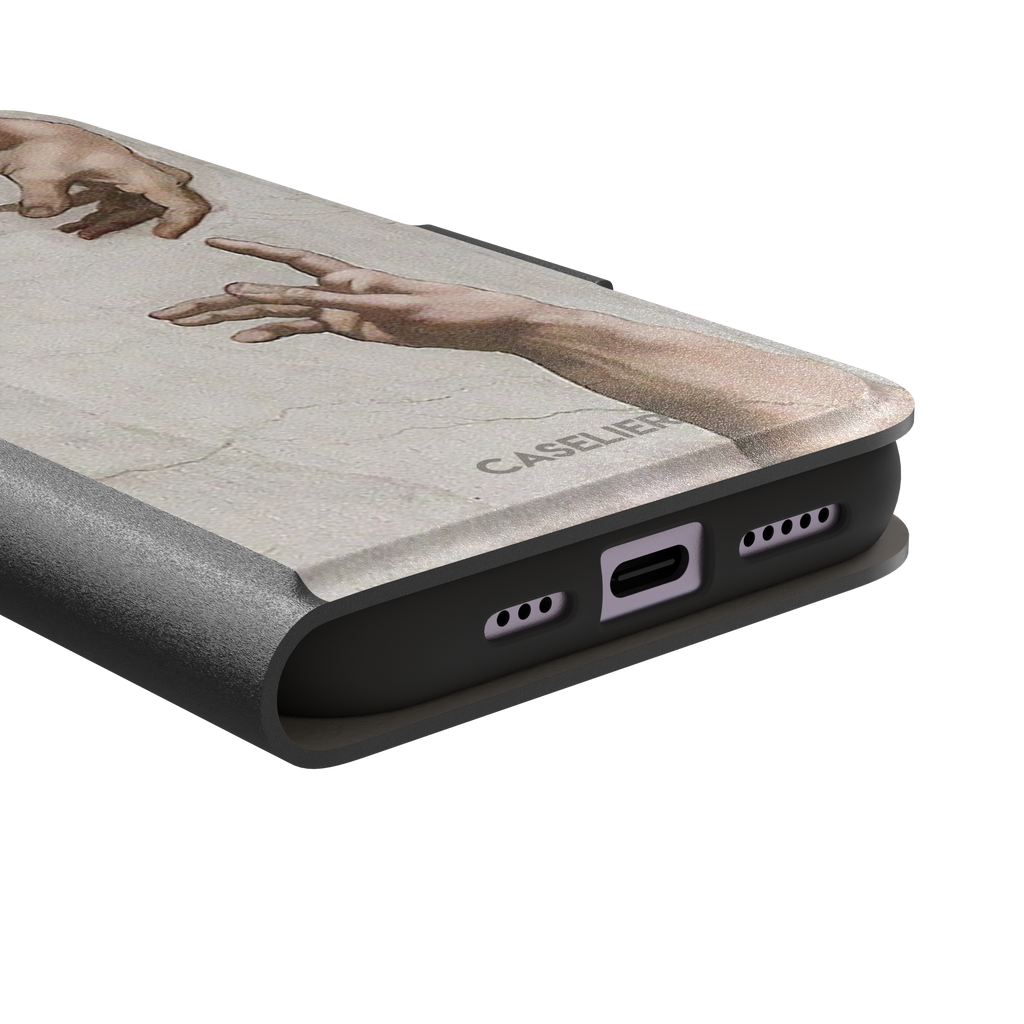Creation of Adam phone case showing Michelangelo's two reaching hands in warm ivory and skin tones against a cracked fresco background, phone case by Caselier — wallet case, charging port detail