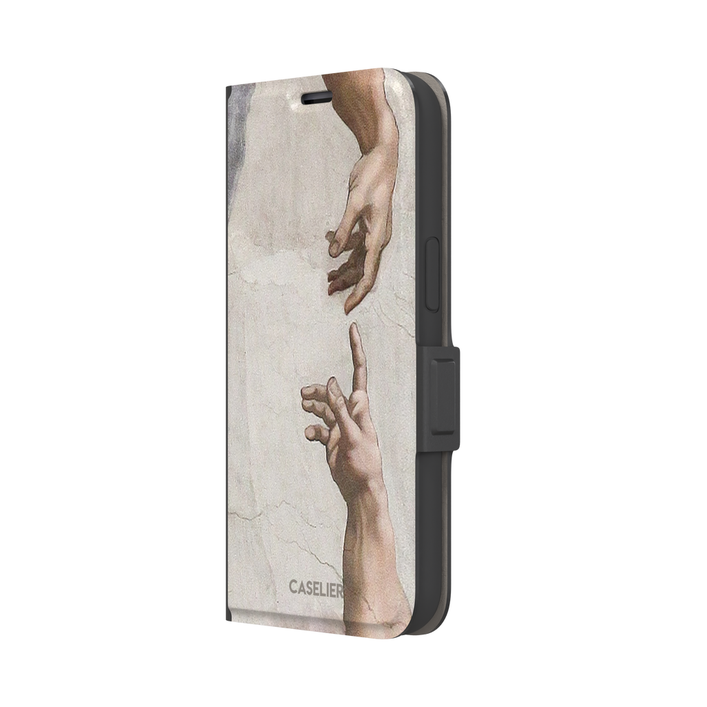 Creation of Adam phone case showing Michelangelo's two reaching hands in warm ivory and skin tones against a cracked fresco background, phone case by Caselier — wallet case, right view